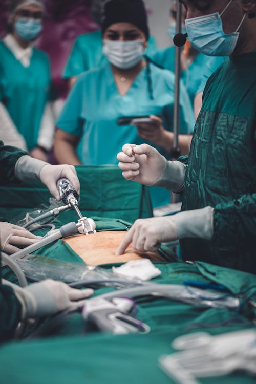 Free Medical Professionals doing an Operation on a Patient  Stock Photo