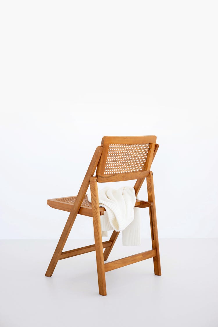 Brown Wooden Folding Chair On White Floor