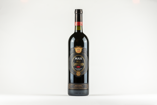 Minimalist product shot of Masi Campofiorin Oro wine bottle with copy space.