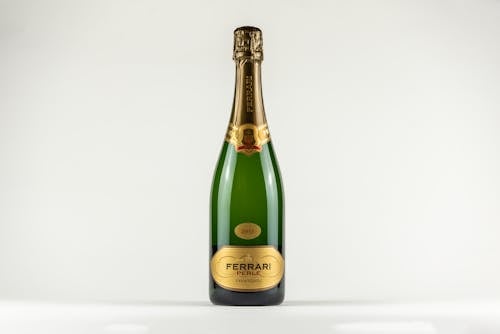 Free Green Champagne Bottle on White Surface Stock Photo