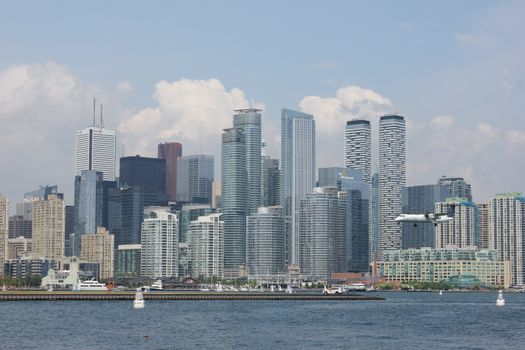 A vibrant view of Toronto's skyline featuring tall skyscrapers and waterfront.