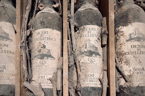 Old and Dusty Labeled Bottles