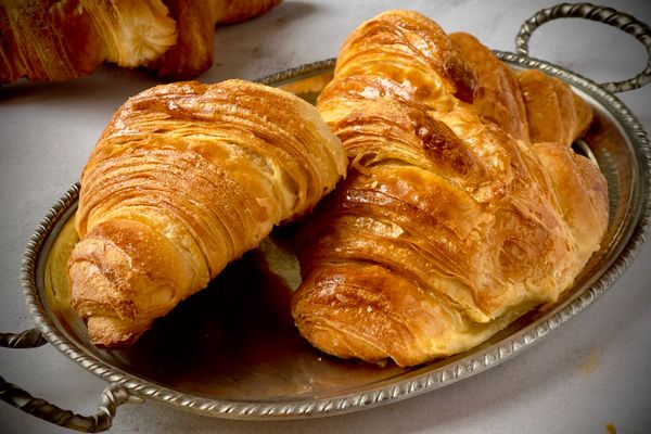 Buttery croissants on a silver tray, photo by Jana Ohajdova on Pexels