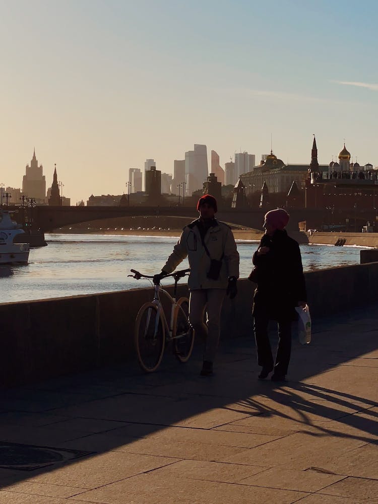 People Walking By The River