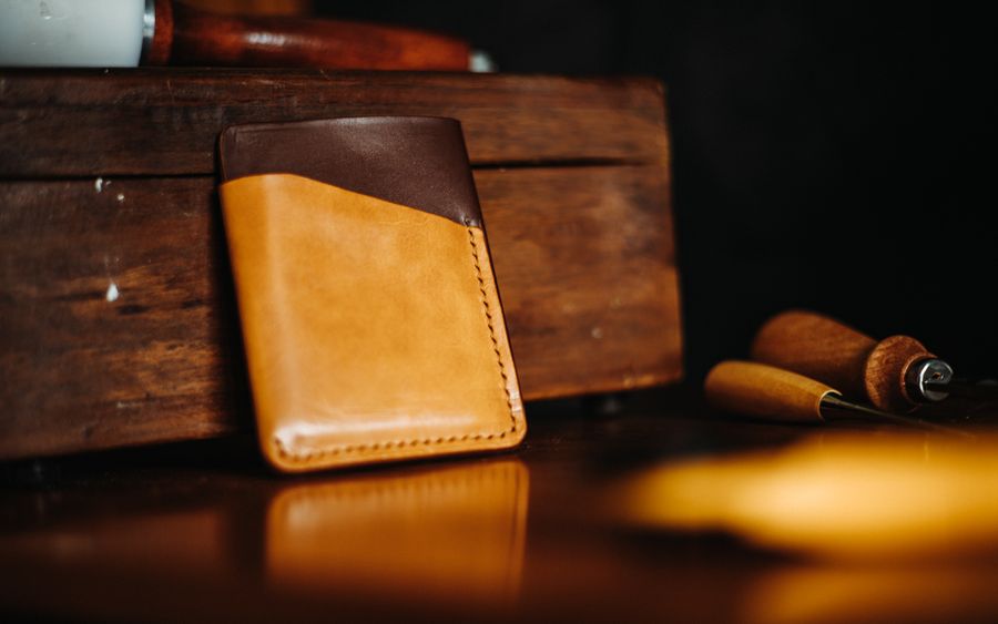 Brown leather bifold wallet close-up
