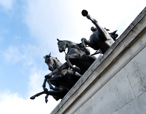 Bronze Trees Monument on Blue Sky