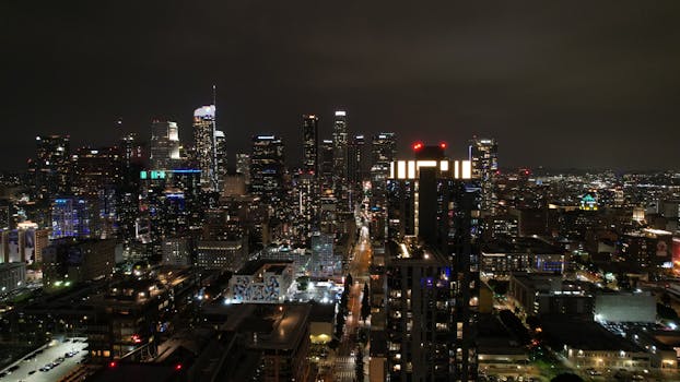 A breathtaking aerial view of Los Angeles downtown skyline illuminated at night.