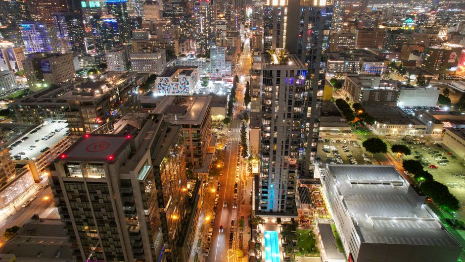 Ultimate Los Angeles Surf to City Tour by Helicopter Review: The Ultimate Coast-to-City Adventure Review 2026 - Elevated nighttime view capturing the illuminated skyline and bustling streets of downtown Los Angeles.