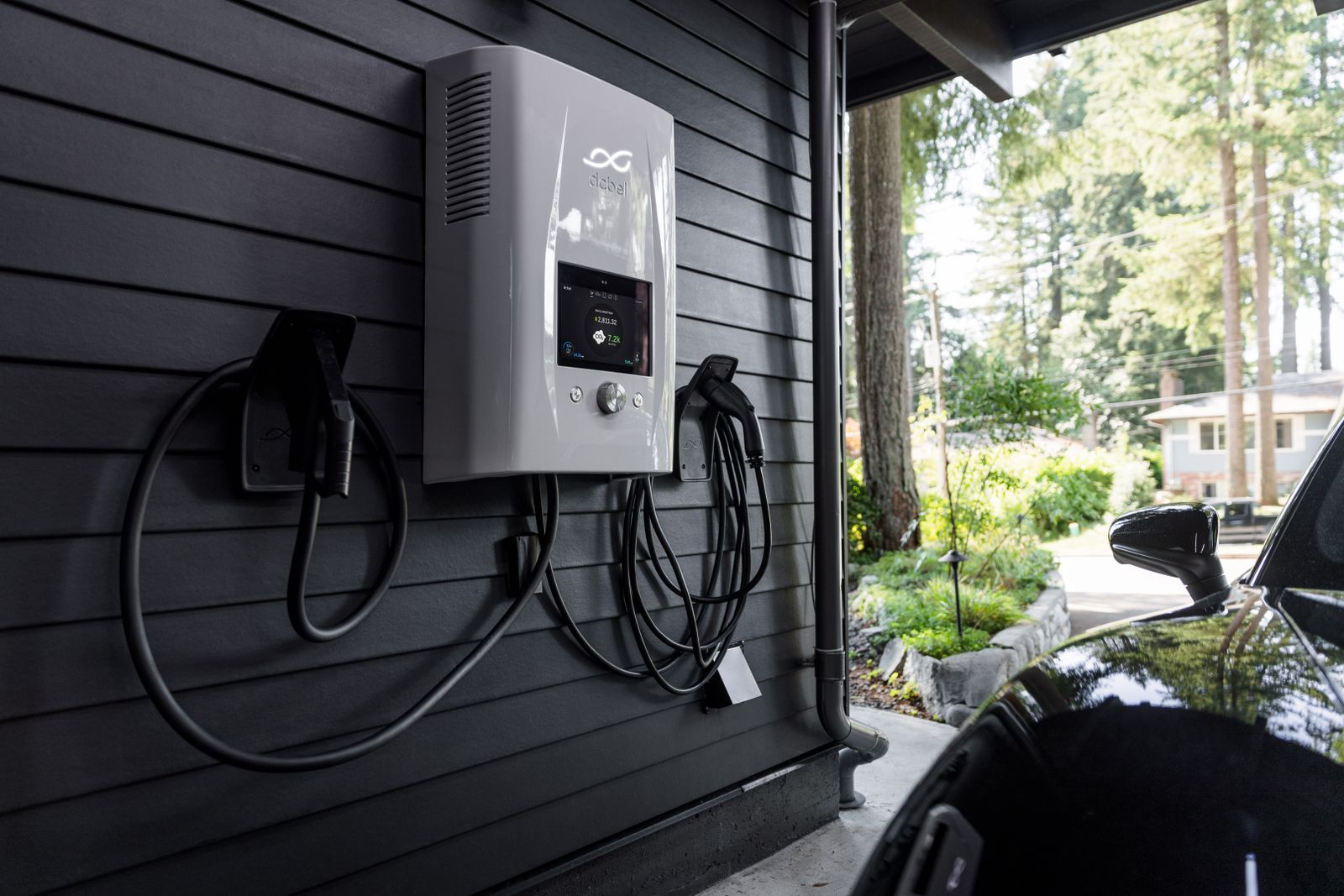 Wall-mounted EV charger installed on the outside of a home