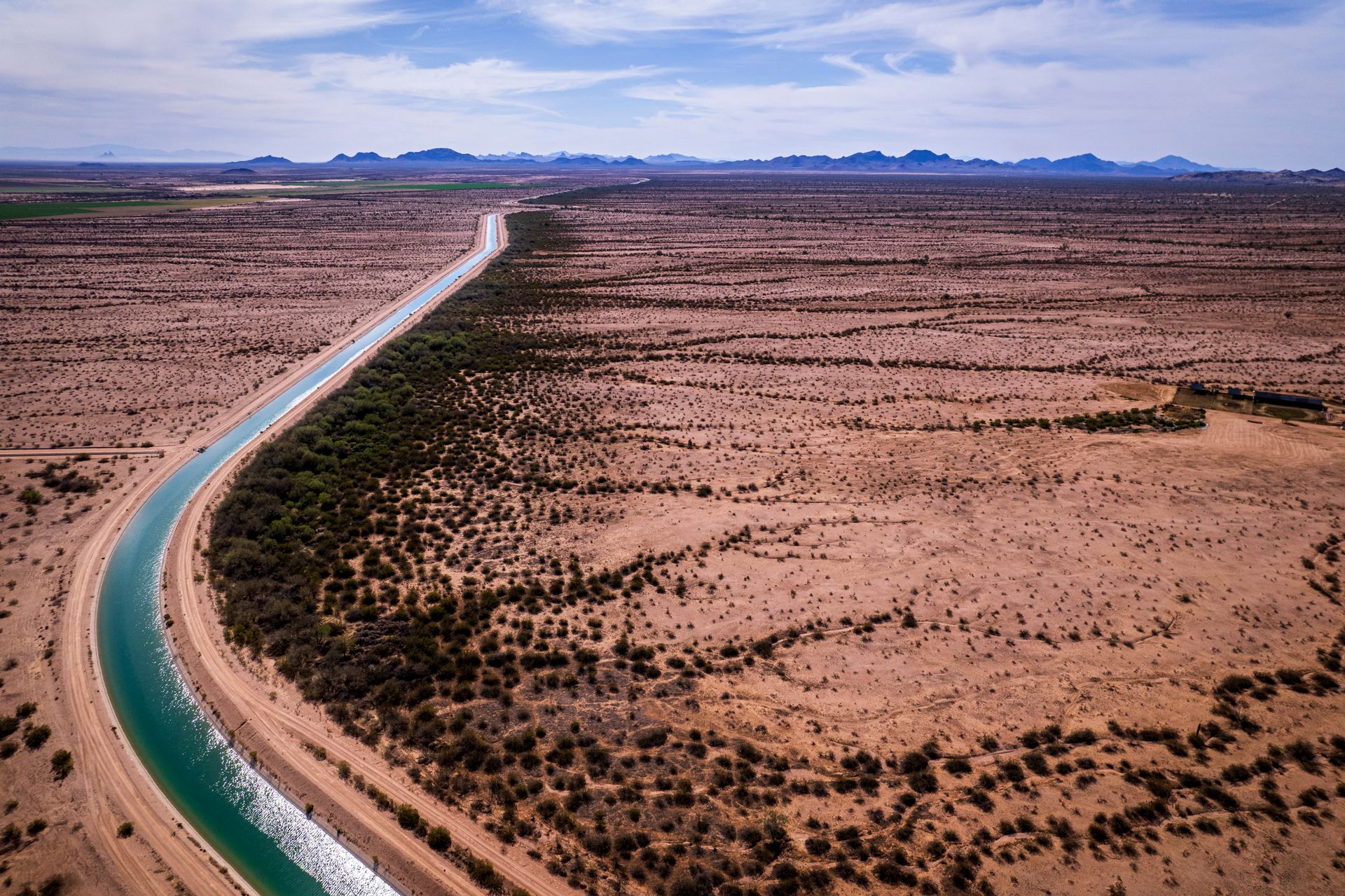 Scenic aerial view of a canal stretching through Casa Grande desert landscape, Arizona.