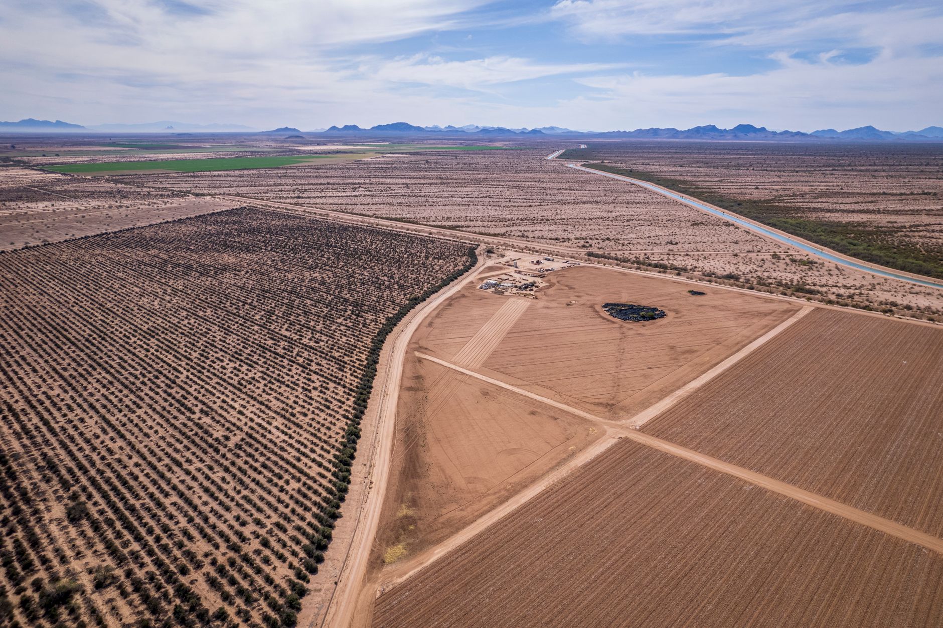 Scenic aerial view of agricultural fields and desert landscape in Casa Grande, Arizona.