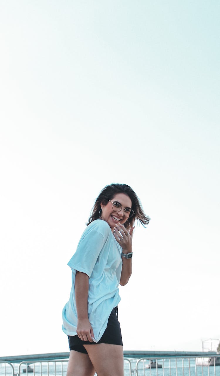 A Woman In White Shirt Laughing