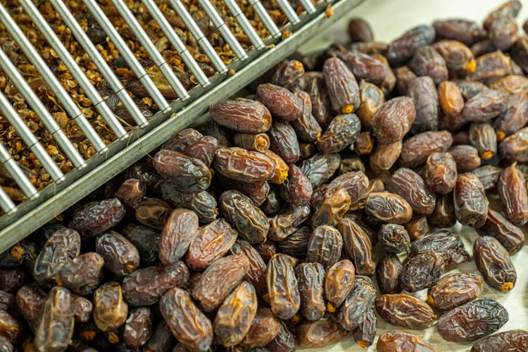 Close-up Of Dates Pile On Table