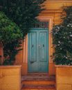 Blue Wooden Door With Green Plants