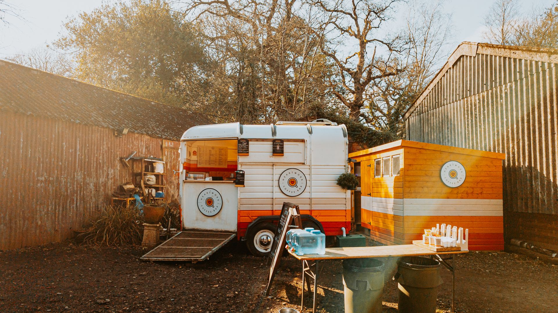 Vintage food truck set in a rustic sunny backyard, perfect for outdoor events.