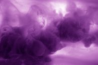 ink in water mauve pink colorful abstract background isolated