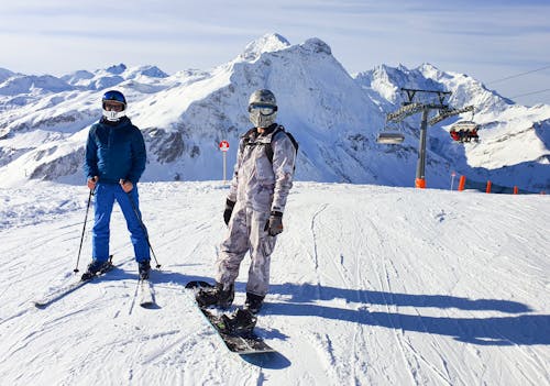 Free  skier ,ski slope the snow,helmet chrome people background  Stock Photo