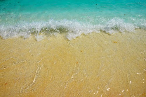Foto profissional grátis de areia, beira-mar, cenário