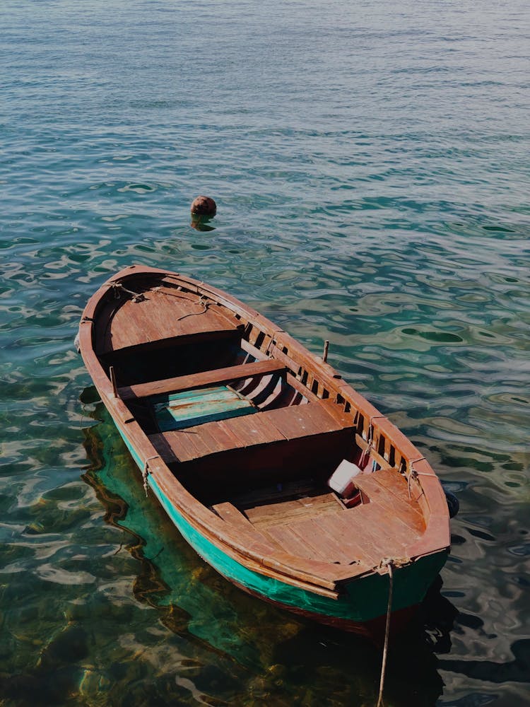 Wooden Boat Anchored On Seashore