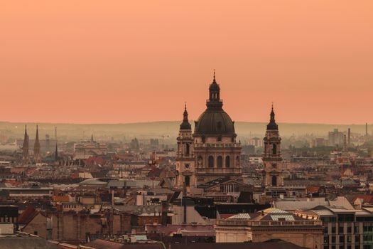 A breathtaking view of Budapest's skyline featuring St. Stephen's Basilica at sunset.