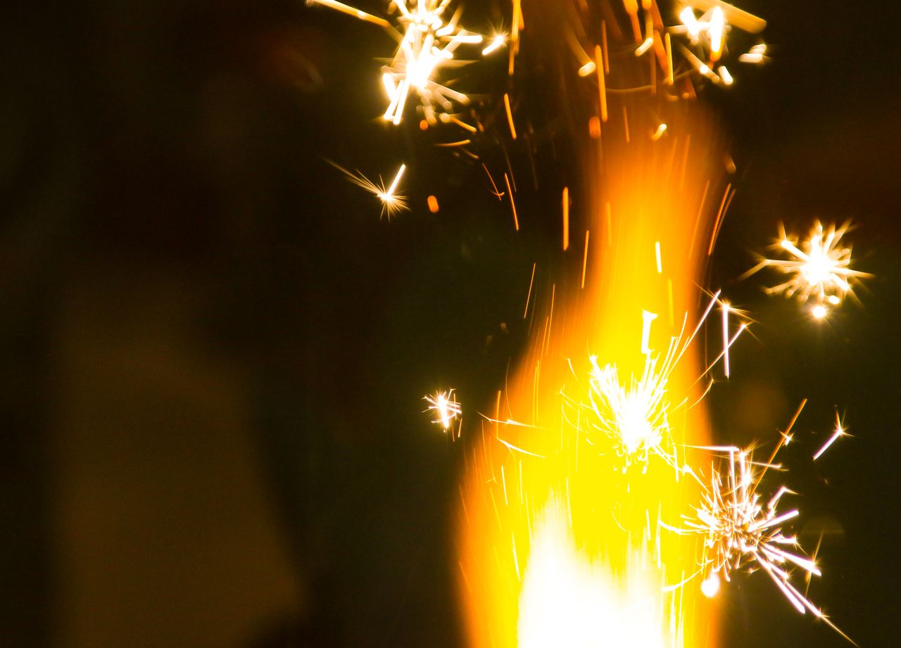 captivating close up of fireworks with bright sparks illuminating the