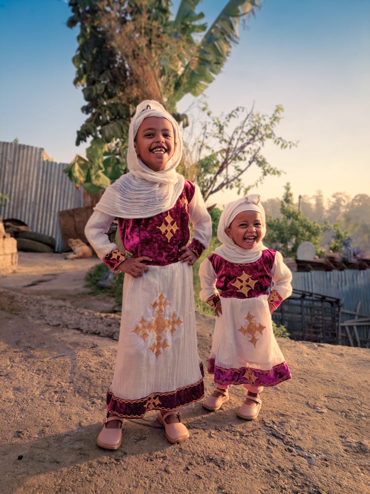 Little Girls Wearing Traditional Dresses