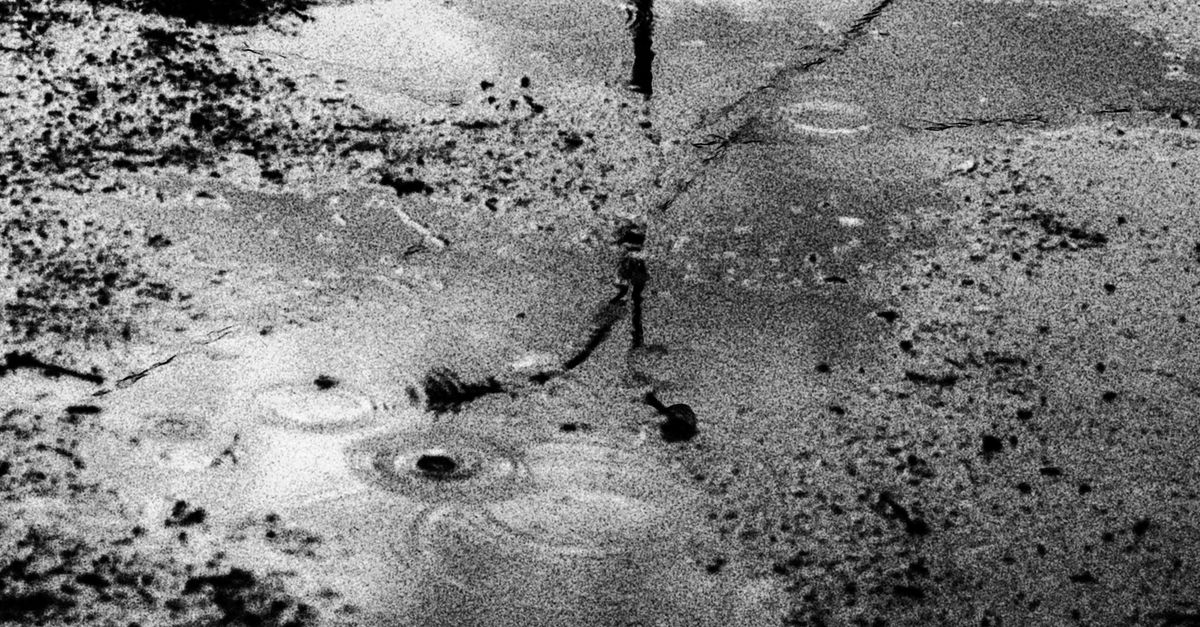 Grayscale Photography of Puddle on Ground · Free Stock Photo