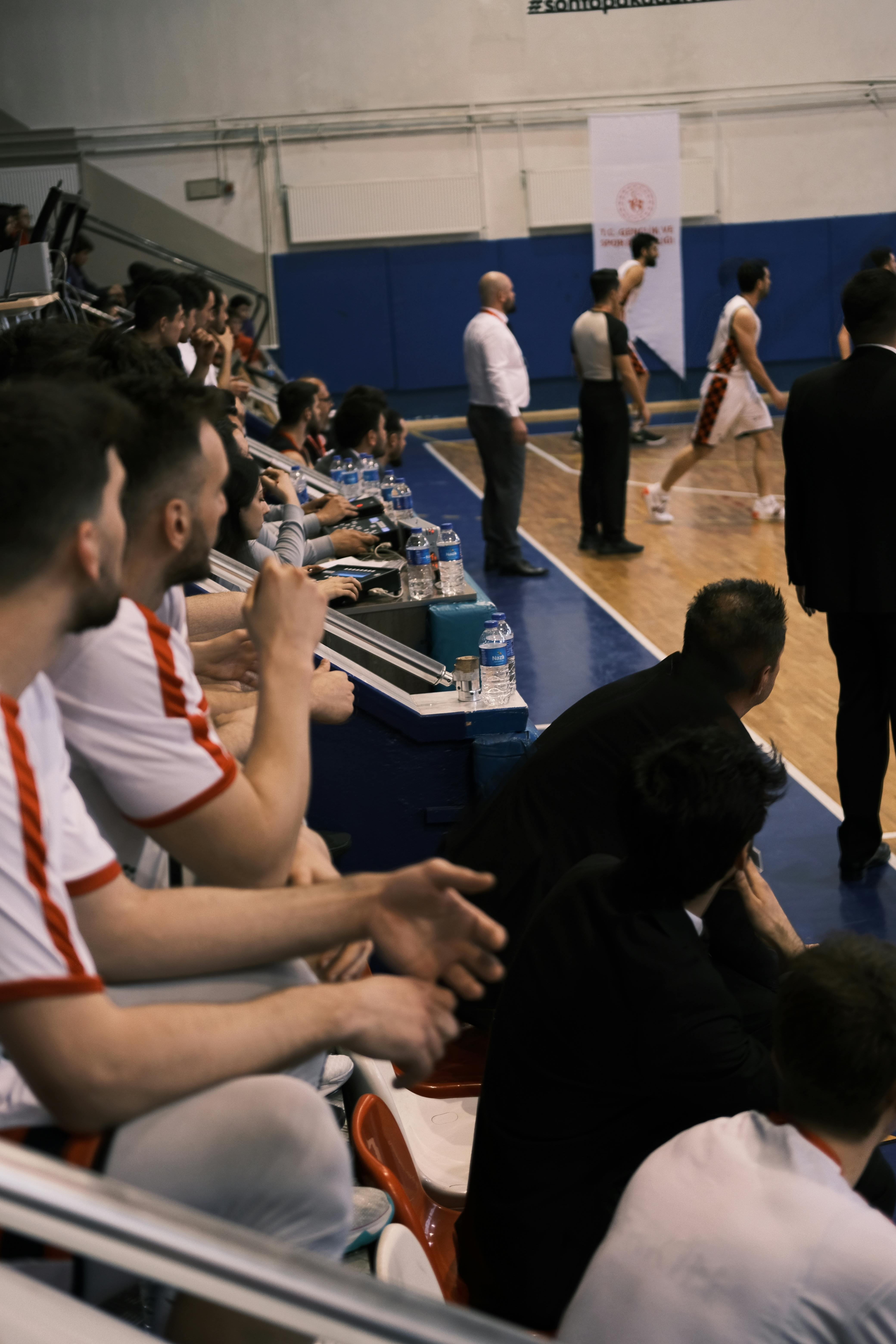 People Sitting on Benches during Basketball Match · Free Stock Photo