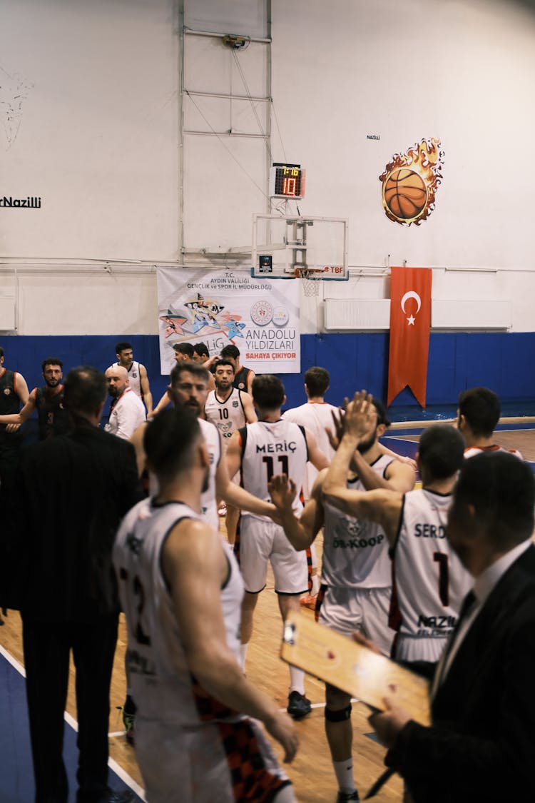 Basketball Players Standing On Basketball Court