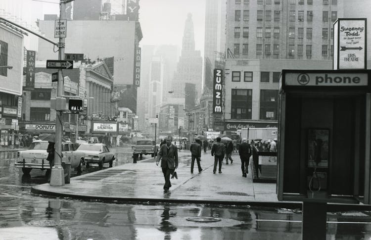 Grayscale Photo Of Busy People Walking On New York City