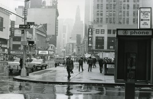 Free Vintage cityscape of New York with people and cars on a rainy street. Stock Photo