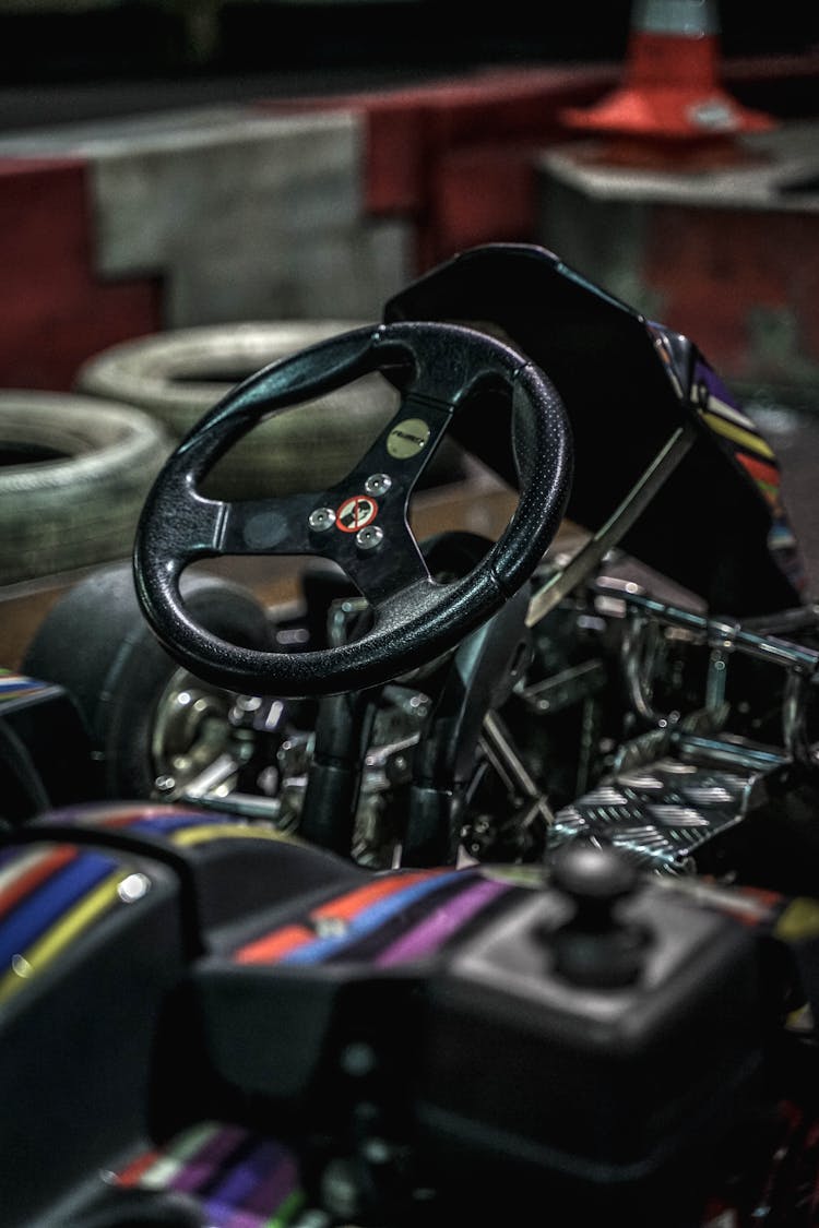 Photograph Of The Steering Wheel Of A Kart