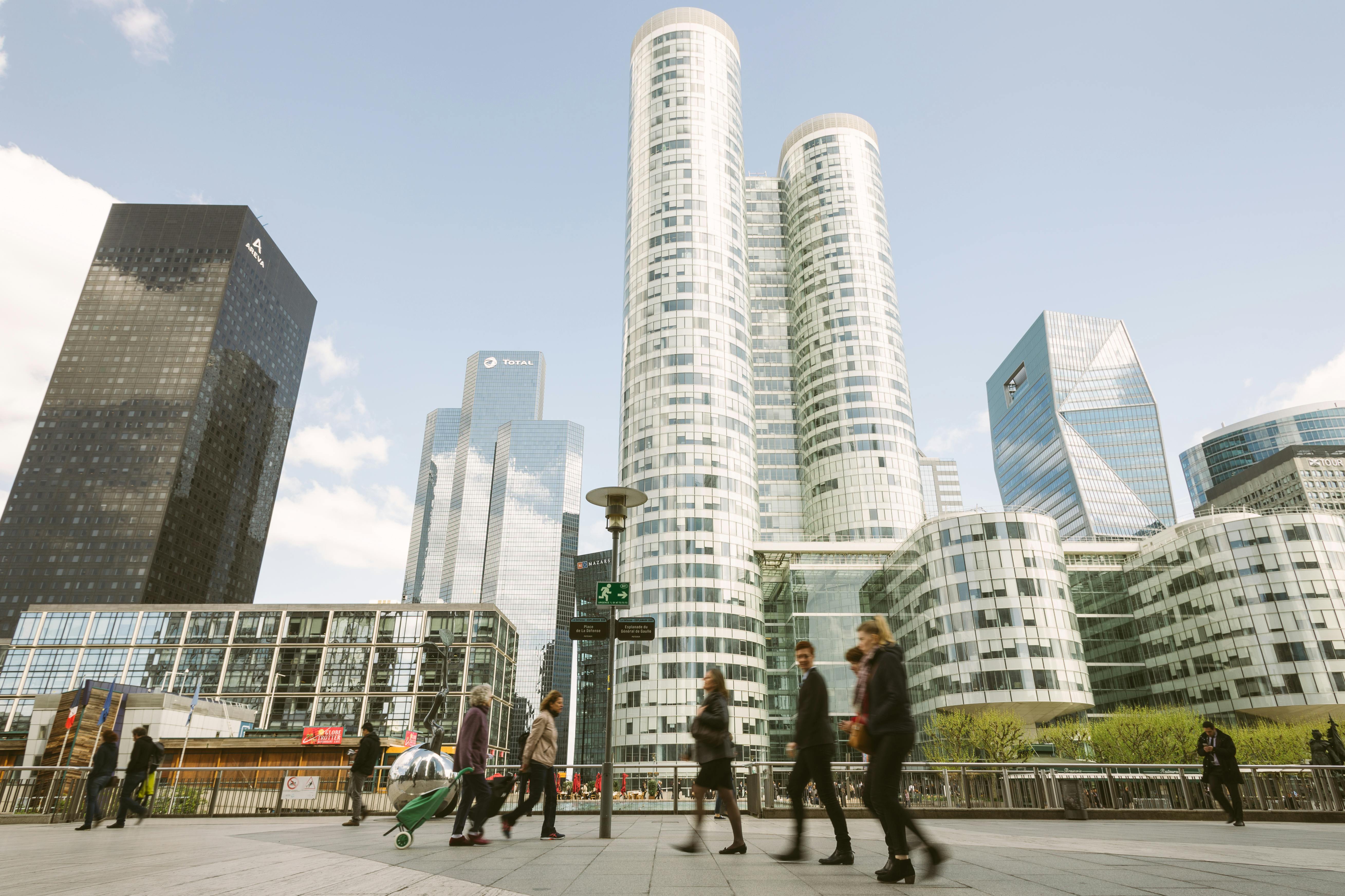 people walking near high rise buildings