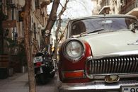 Old car with motorcycle