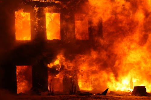 Free A Burning House Covered with Flames Stock Photo