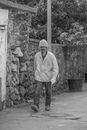 Man in Long Sleeve Shirt Walking on Sidewalk