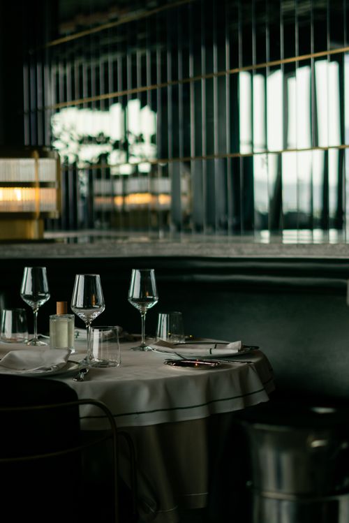 Free A sophisticated dining table setting in an upscale restaurant in İstanbul, Turkey, showcasing fine glassware and ambient lighting. Stock Photo