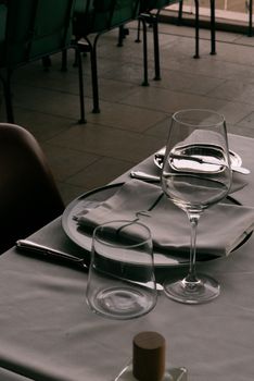 Sophisticated restaurant table setting with cutlery and wine glass in Istanbul, Turkey.