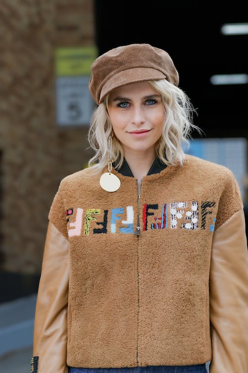 Free Fashionable Woman Wearing Brown Jacket and Hat Stock Photo