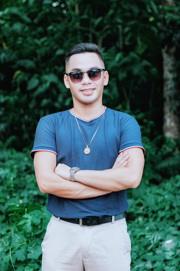 Man In Blue T Shirt Wearing Sunglasses