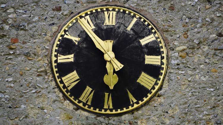 Round Black And Yellow Analog Clock