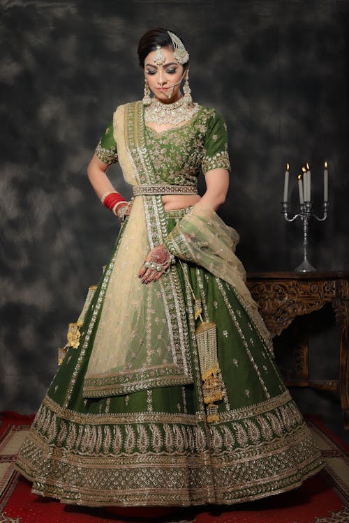 Free A Woman Wearing a Green Traditional Bridal Dress Stock Photo