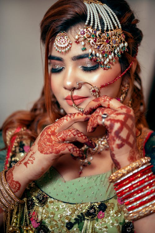 Woman in Traditional Bridal Dress and with Bridal Henna Tattoos