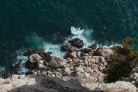 Brown Rocks Near Body of Water