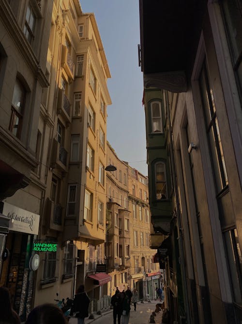 People Walking on Narrow Alley