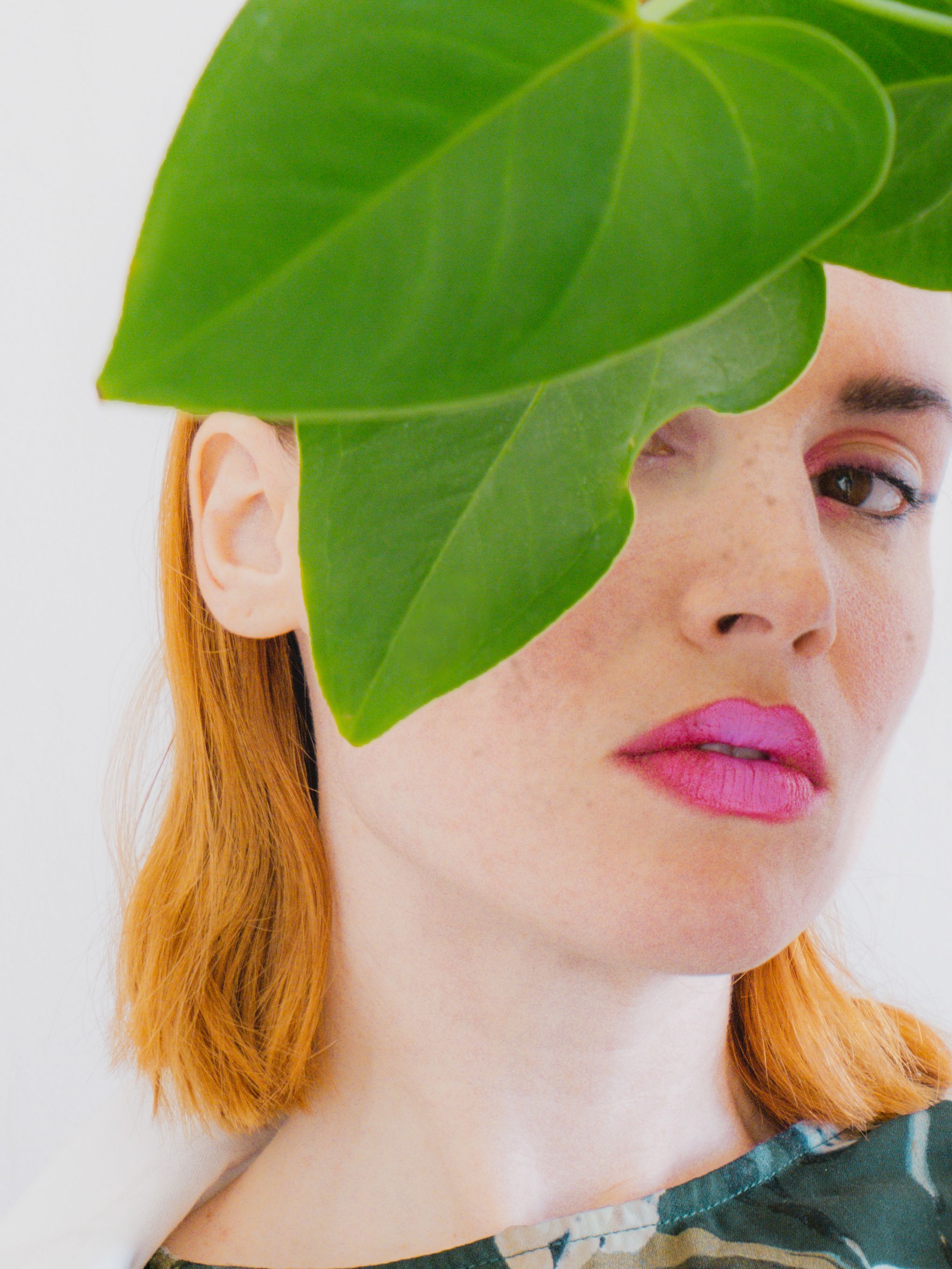 Woman with Green Leaves Covering Her Face Close-Up Photo · Free Stock Photo
