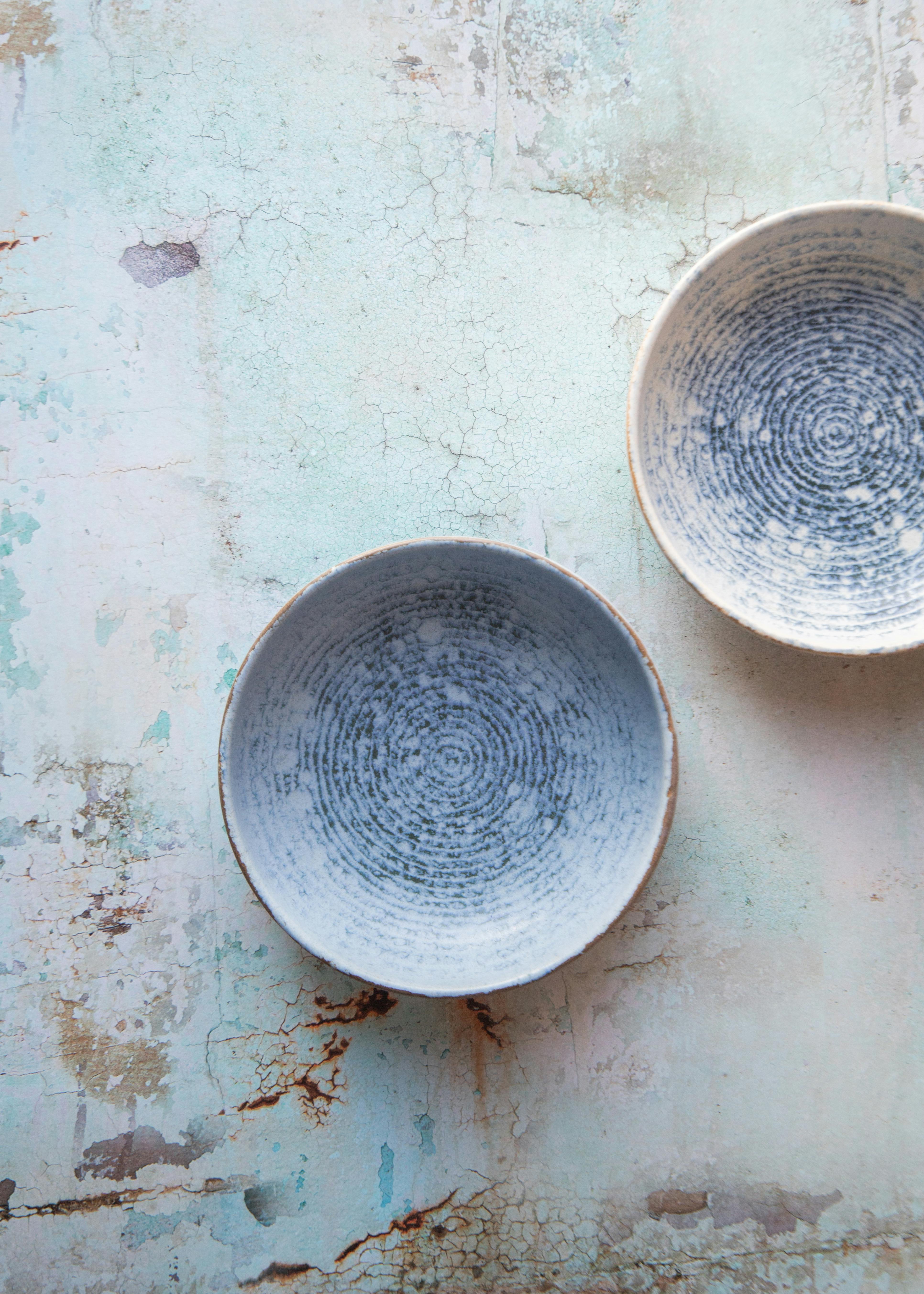 Top view of elegant ceramic bowls with a vintage textured design, perfect for kitchen decor.