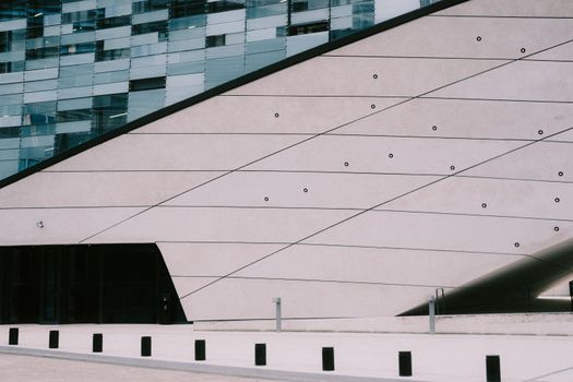Contemporary building facade featuring sleek lines and modern geometric design elements.