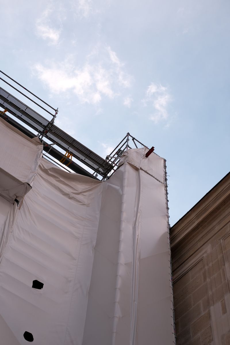 Representative photo of scaffolding covering a building facade during renovation