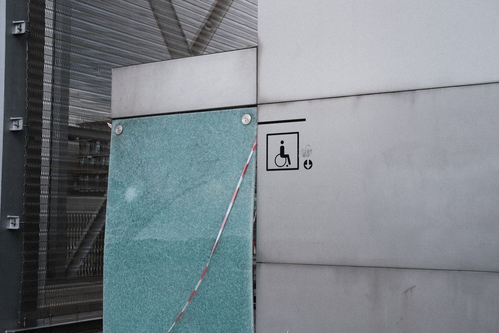 Accessibility symbol displayed on a modern building facade